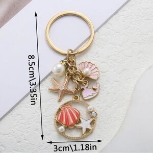 Set of 2 Gold Shell & Starfish Charm Keyring - One each Pink and Baby Blue